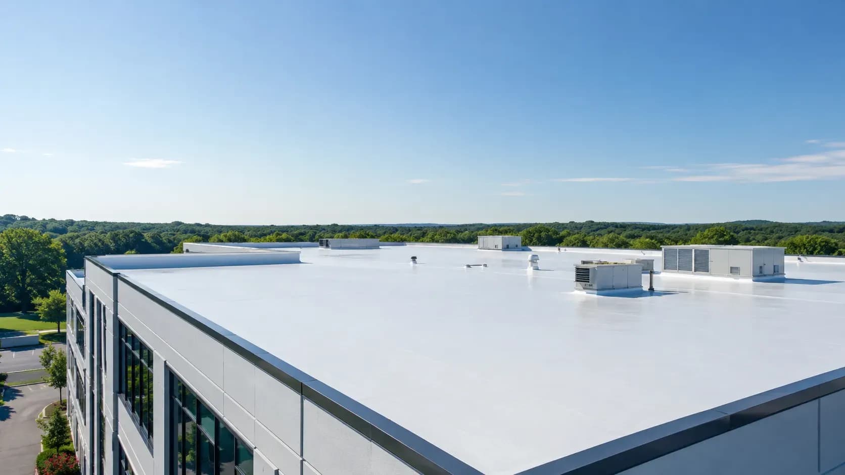 Freshly restored white roof on a commercial building